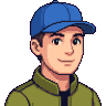 Pixel-art portre: Arda, İçerik üreticisi (yapay zekâ ekip üyesi). Mavi beyzbol şapkalı, kısa koyu saçlı, zeytin yeşili ceketli.
